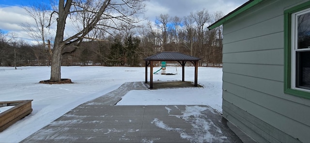 snowy yard with a gazebo