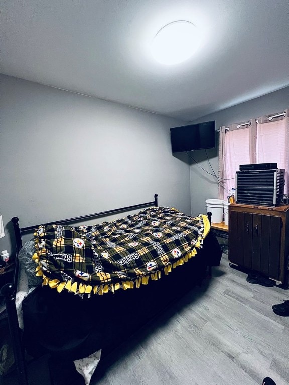 bedroom featuring wood finished floors