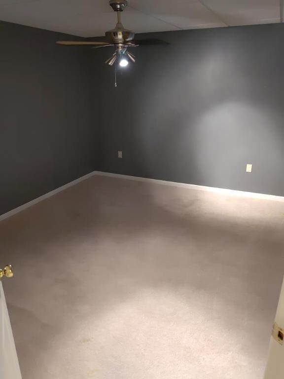 carpeted empty room with ceiling fan