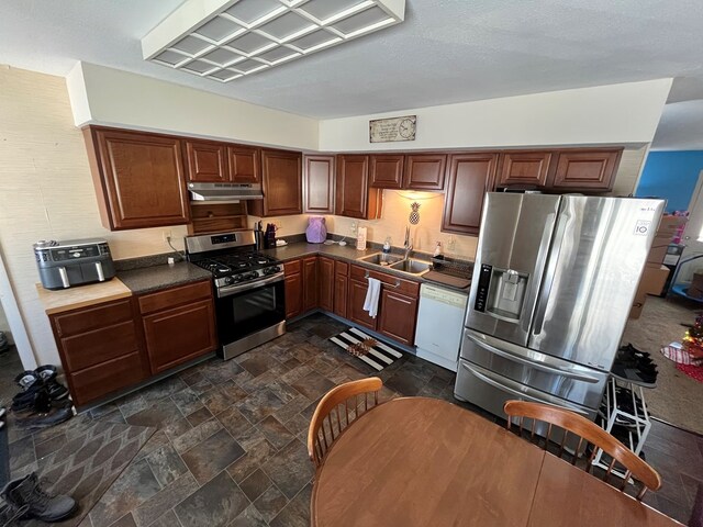 kitchen featuring stainless steel appliances and sink