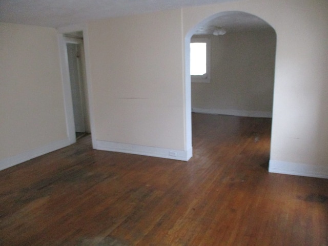 unfurnished room with dark hardwood / wood-style floors