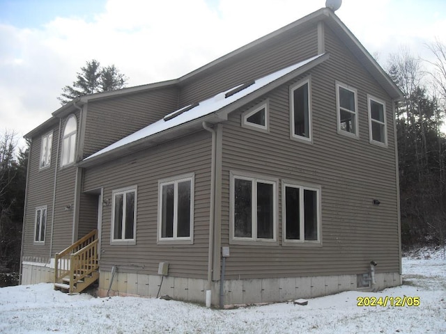 view of snow covered property