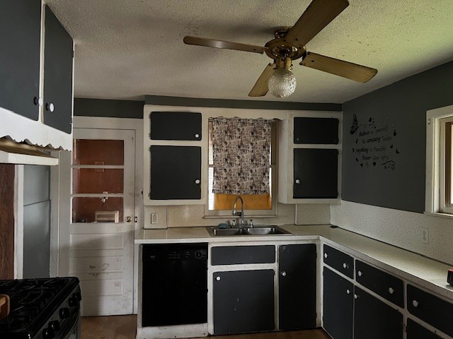 kitchen featuring dark wood-type flooring, sink, a textured ceiling, ceiling fan, and black appliances