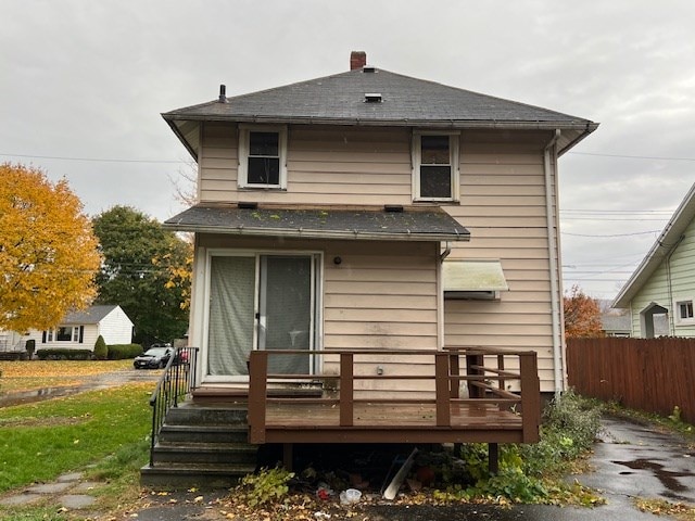 rear view of property with a wooden deck