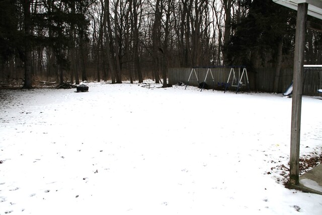 view of yard layered in snow