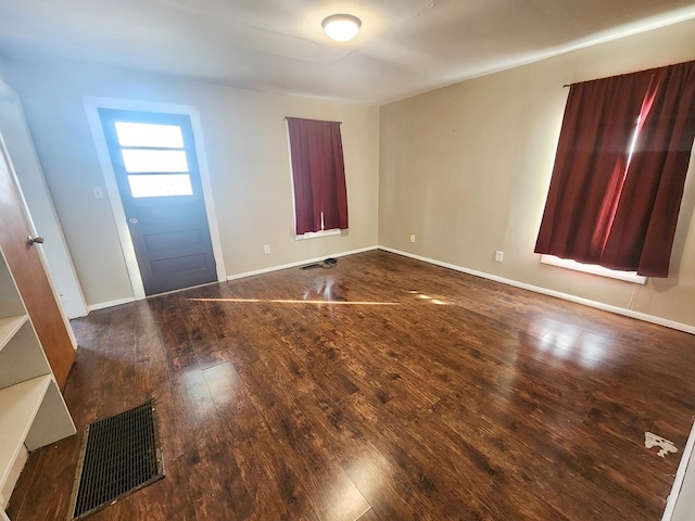 foyer entrance featuring dark hardwood / wood-style floors