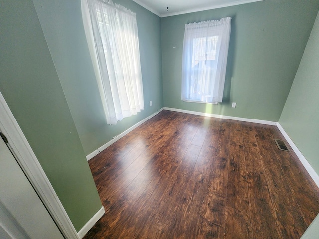 empty room with dark hardwood / wood-style floors