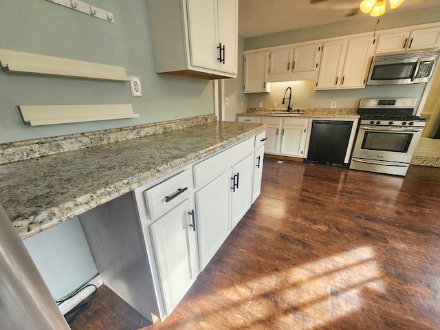 kitchen featuring stainless steel appliances, sink, and white cabinets