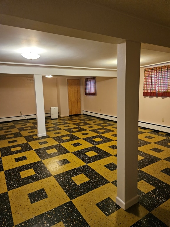 basement featuring a baseboard heating unit