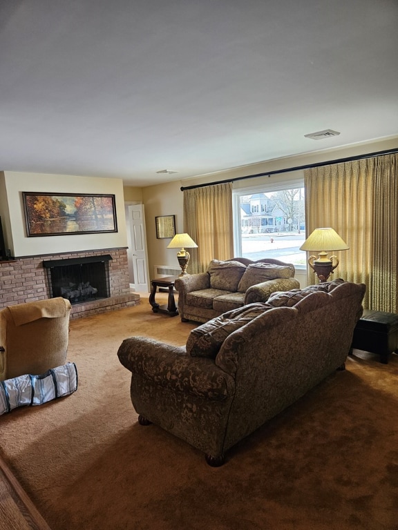 carpeted living room with a fireplace