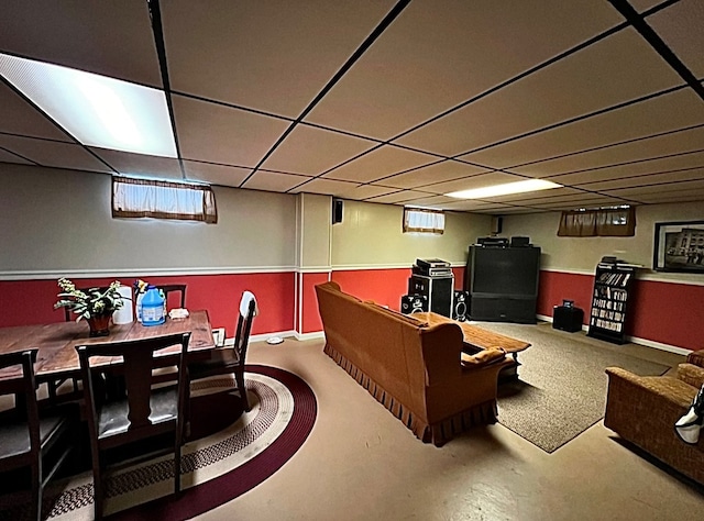 interior space featuring a wealth of natural light and a paneled ceiling