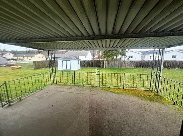 view of patio with a storage shed