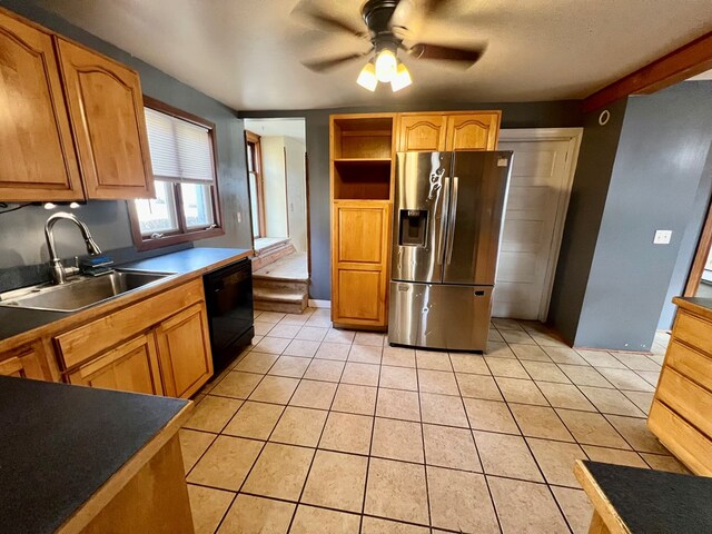 kitchen with sink, dishwasher, ceiling fan, light tile patterned flooring, and stainless steel fridge with ice dispenser