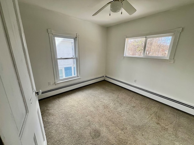 empty room featuring ceiling fan, a healthy amount of sunlight, and carpet