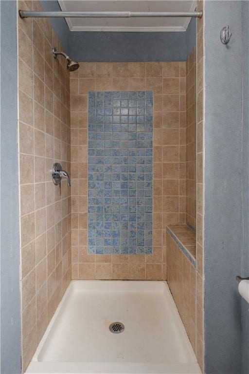 full bath with a tile shower