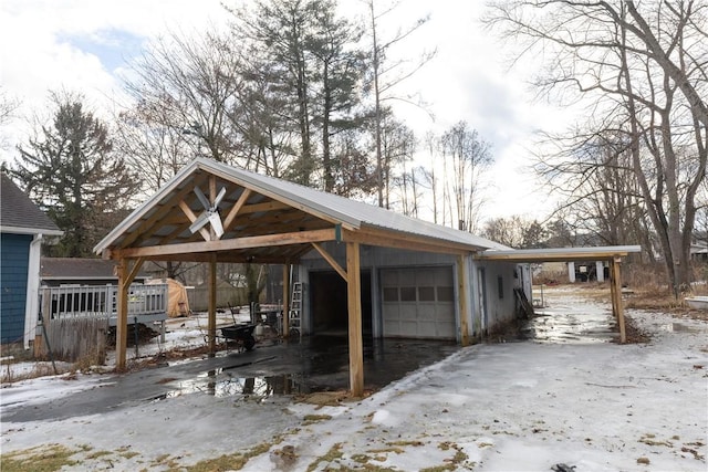 view of front of home with a detached garage