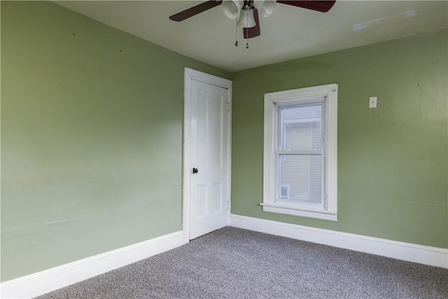 unfurnished room with ceiling fan, carpet, and baseboards