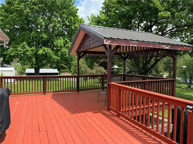 175 Beartown Rd, Erwin, NY 14870 - deck with a gazebo, view of wooded area, a storage shed, and an outbuilding