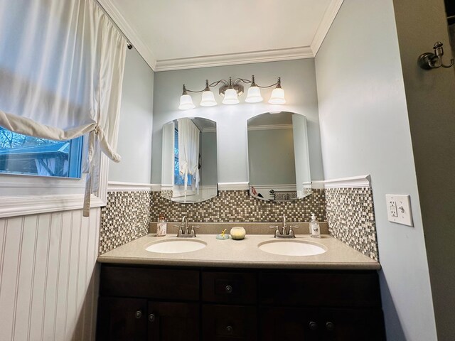 bathroom with ornamental molding and vanity