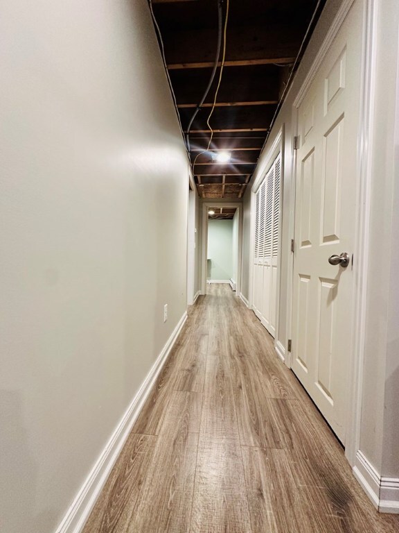 hallway featuring hardwood / wood-style flooring