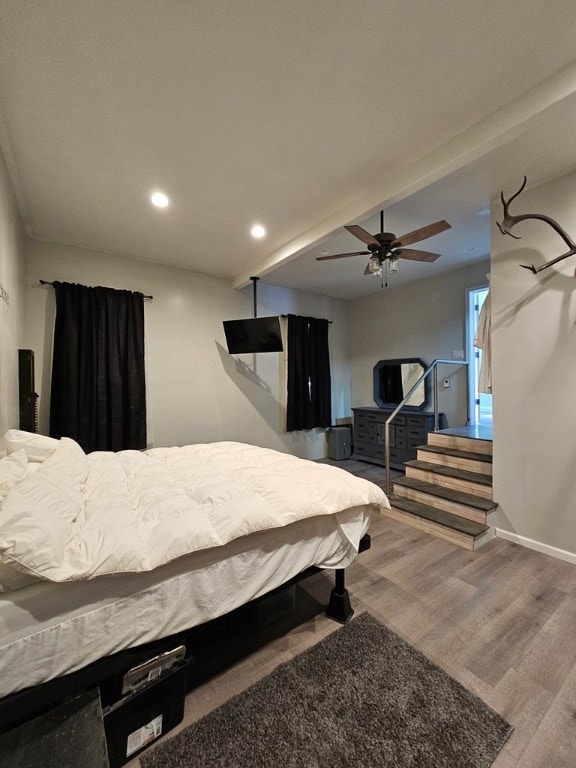 bedroom featuring hardwood / wood-style flooring and ceiling fan