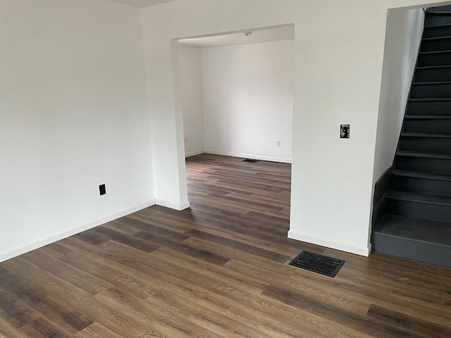 spare room featuring dark hardwood / wood-style flooring