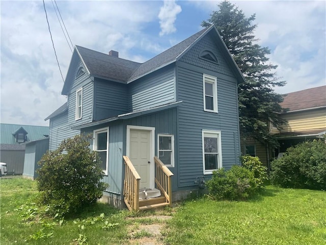 350 E High St, Erwin, NY 14870 - back of house featuring entry steps, roof with shingles, a yard, and a chimney