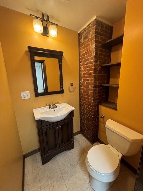 bathroom with vanity, tile patterned floors, and toilet