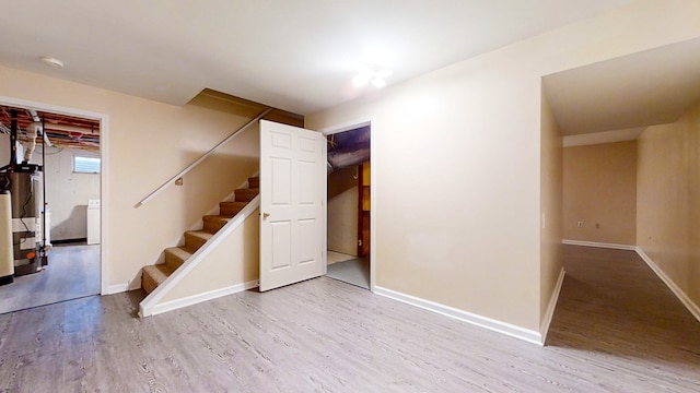 11827 Lando Ln, Corning, NY 14830 - basement with baseboards, wood finished floors, and stairs