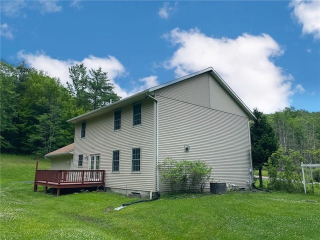 11827 Lando Ln, Corning, NY 14830 - view of side of property featuring a deck, a yard, and a view of trees