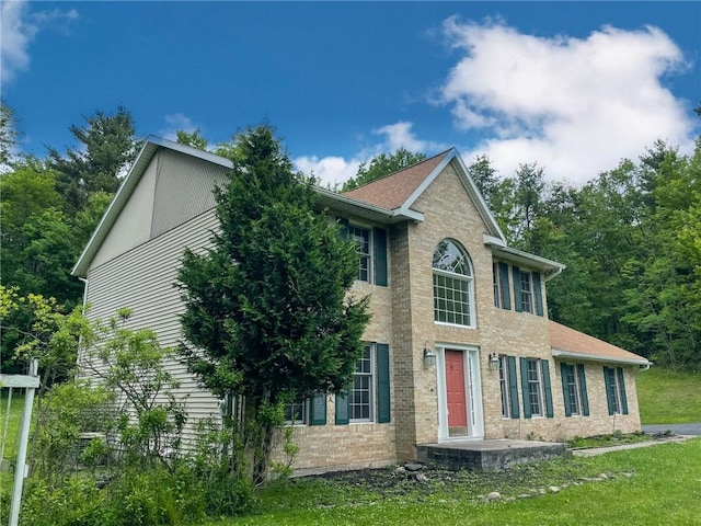 11827 Lando Ln, Corning, NY 14830 - colonial house with brick siding and a front lawn