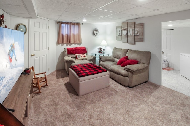 living room with light colored carpet and a paneled ceiling