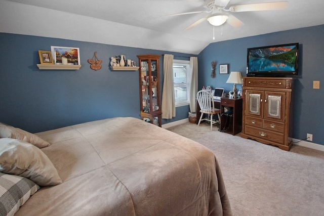 bedroom with lofted ceiling, light colored carpet, and ceiling fan