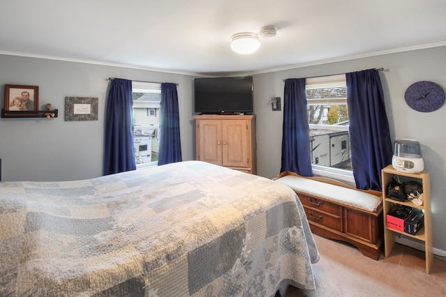 carpeted bedroom featuring crown molding