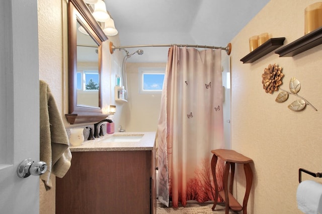 bathroom featuring vanity and walk in shower