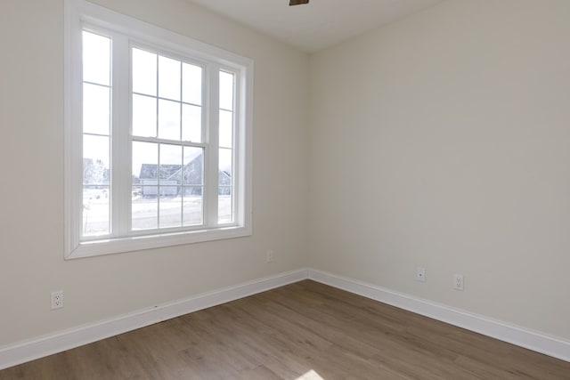 unfurnished room featuring ceiling fan and hardwood / wood-style floors