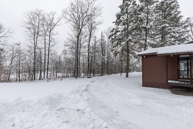 view of yard layered in snow