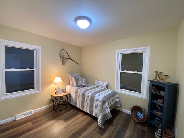 bedroom featuring dark hardwood / wood-style floors