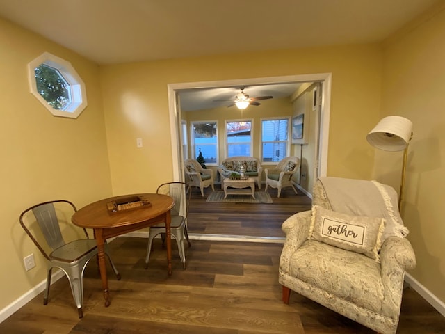 sitting room with wood-type flooring, plenty of natural light, and ceiling fan