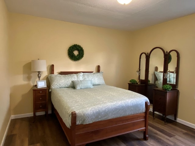 bedroom featuring dark hardwood / wood-style floors