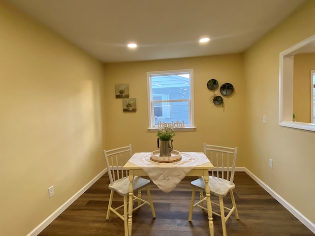 dining space featuring dark hardwood / wood-style floors