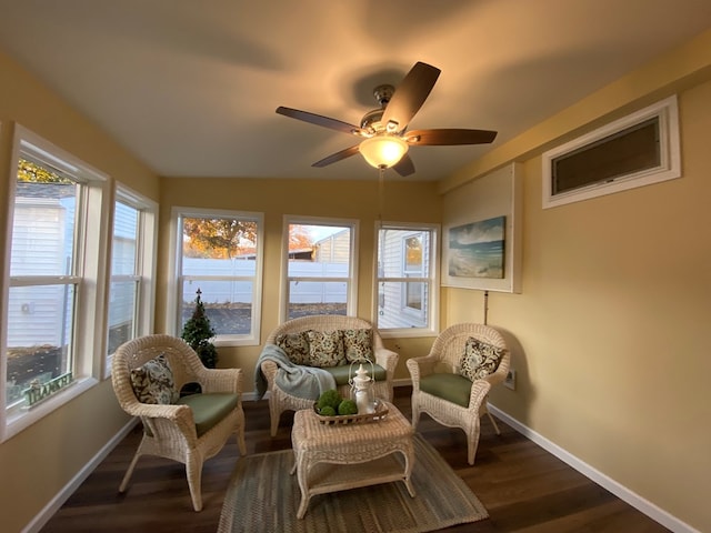 sunroom featuring ceiling fan