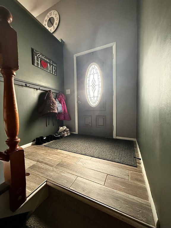 foyer entrance with wood-type flooring