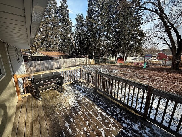 wooden deck featuring grilling area