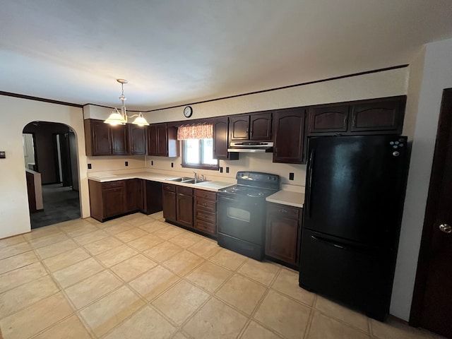 kitchen with dark brown cabinetry, hanging light fixtures, black appliances, and sink