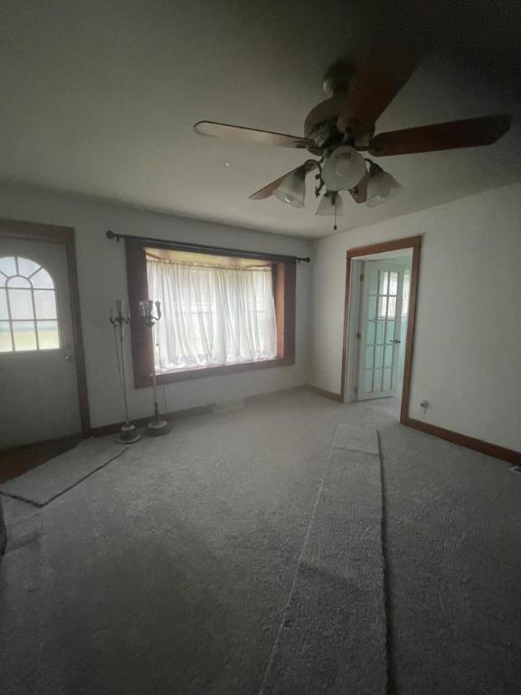 72 Hickory Grove Rd, Horseheads, NY 14845 - unfurnished living room with a ceiling fan, carpet floors, and healthy amount of natural light