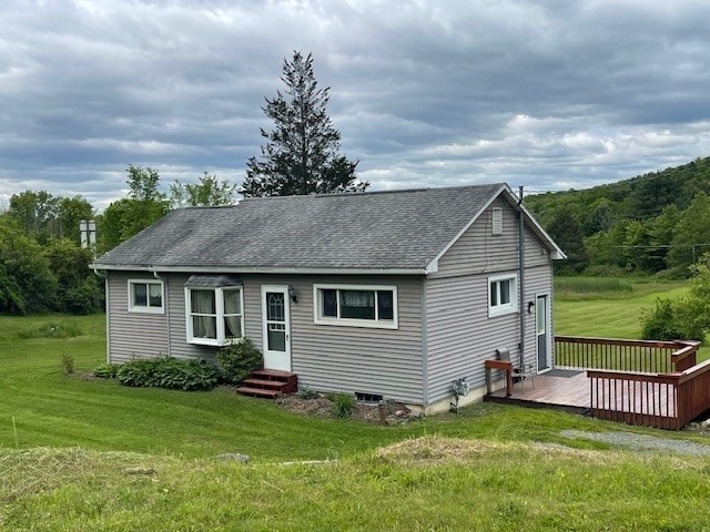 72 Hickory Grove Rd, Horseheads, NY 14845 - view of front of house featuring a front yard, roof with shingles, a deck, and entry steps