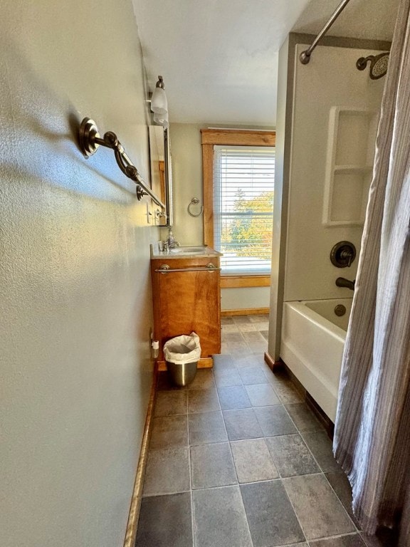 bathroom with vanity and washtub / shower combination