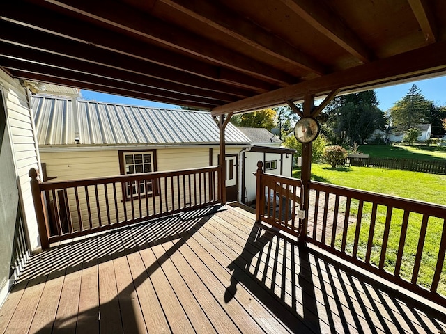 wooden terrace featuring a yard