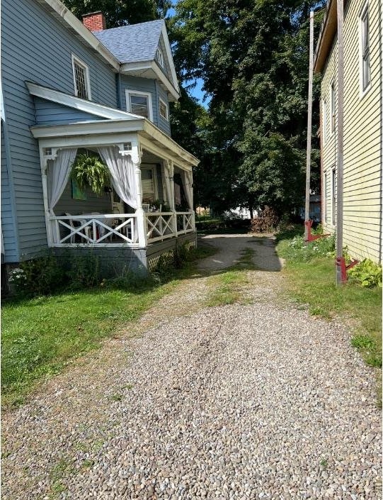 view of property exterior featuring a porch